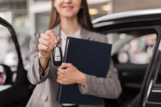 person handing car keys