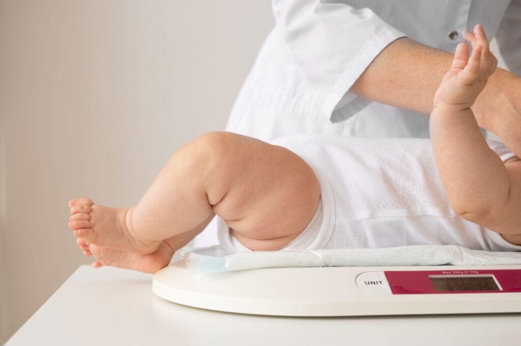 baby on weight scale