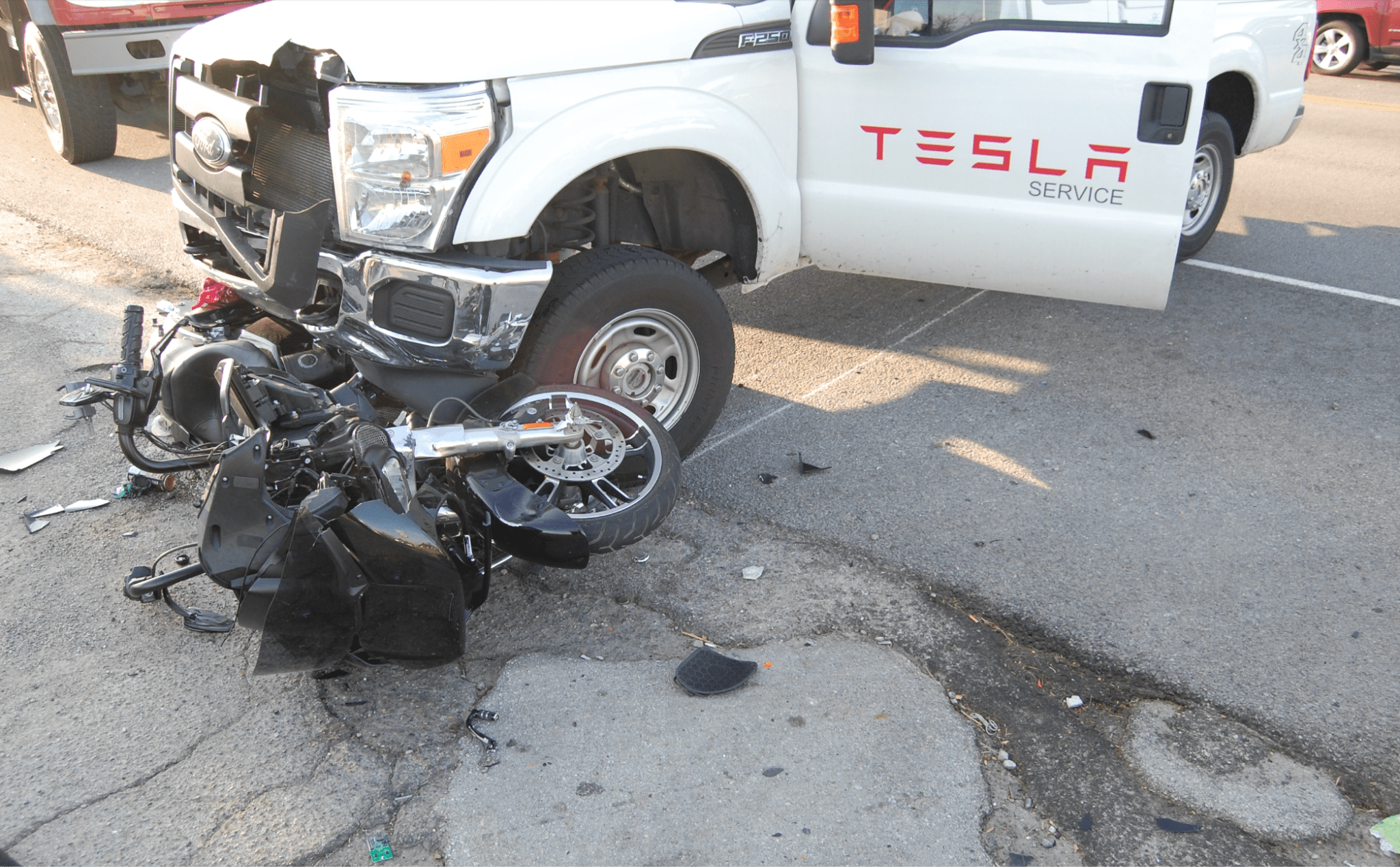 actual photo of Tesla truck crashing into a motorcycle