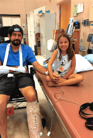 Christopher Dugan and his daughter after the accident