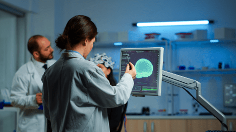 doctor looking at brain scan of patient