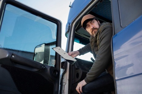 Man in truck with clipboard