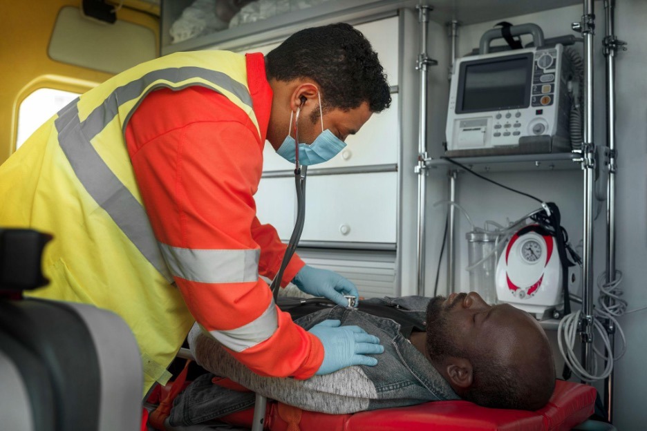 person being taken care of in ambulance