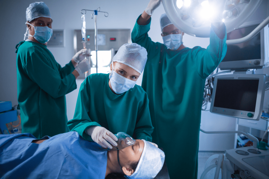 Medical team performing surgery in operating room