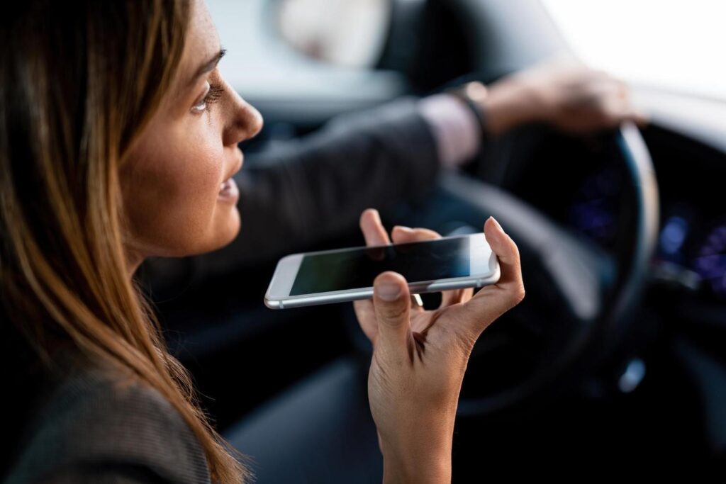 a woman calling with her phone while driving