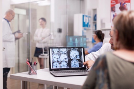 doctor checking brain scan